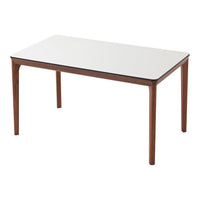 White tabletop with walnut wood legs, featuring a sleek, modern design. Perfect for contemporary dining spaces.