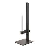 Black metal candle holder with a sleek, modern design and a simple white candle.