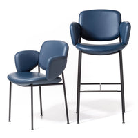 Stylish blue leather dining chairs with smooth patterns and sleek black metal legs. Perfect for modern interiors.