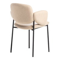 Beige upholstered chair with smooth curves, featuring black metal legs for a modern contrast.
