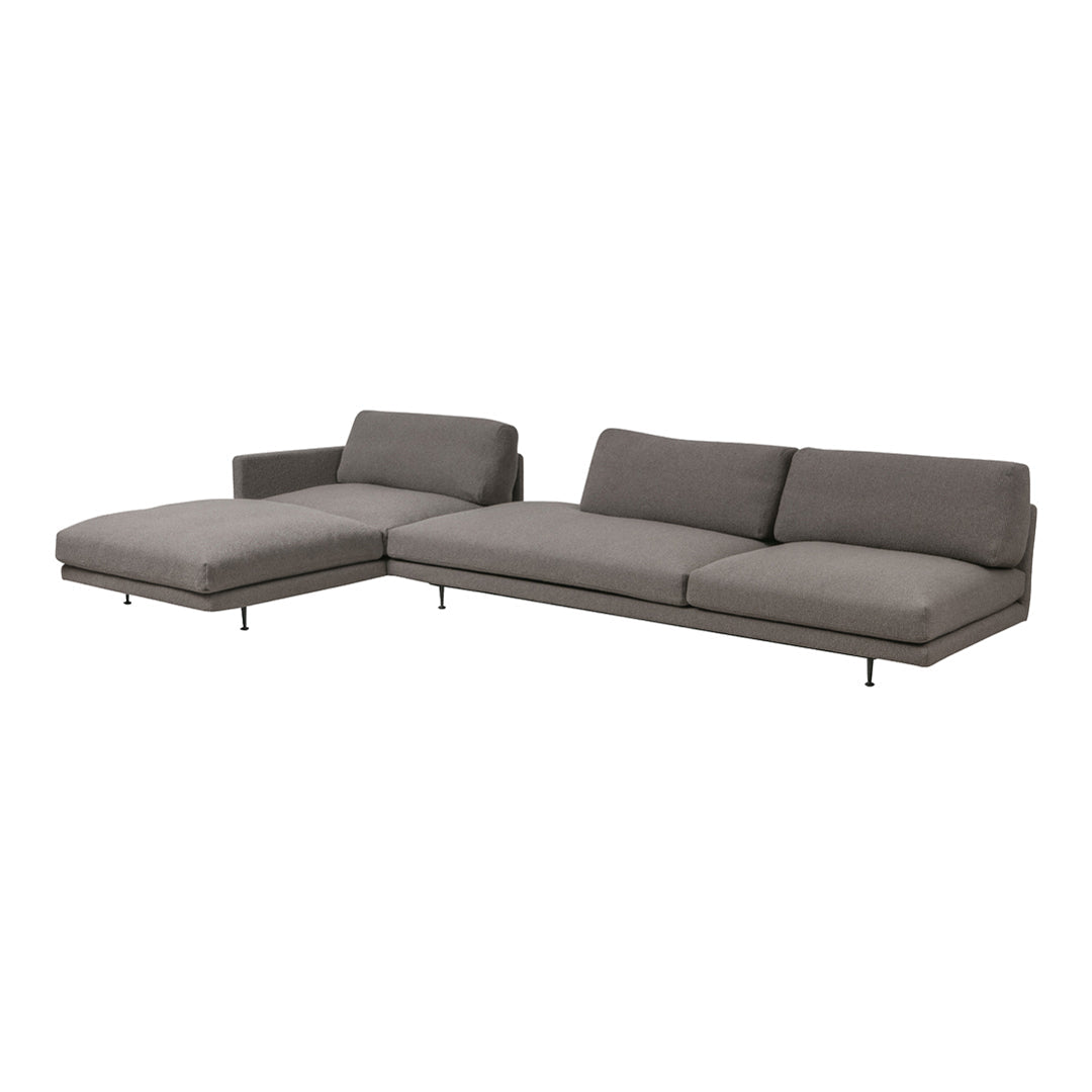 Gray sectional sofa with a sleek, modern design and clean lines, perfect for contemporary living spaces.