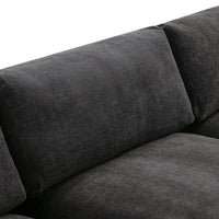 Textured dark gray sofa upholstery with a smooth finish, perfect for modern living spaces.