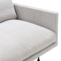 Light grey fabric chaise lounge with a smooth, minimalist design and subtle texture. Ideal for modern decor.