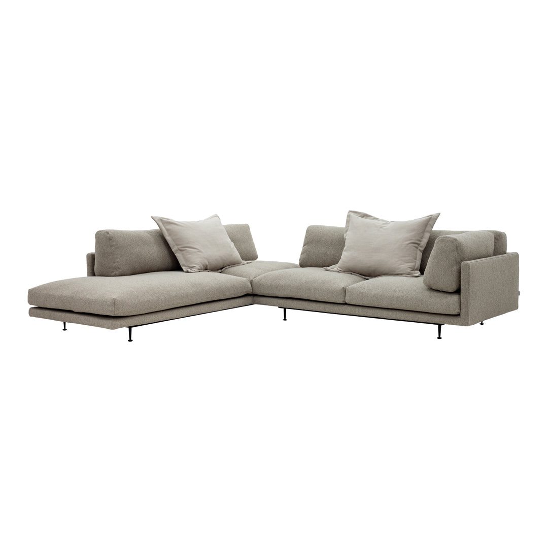 Light gray sectional sofa with a minimalist design and soft fabric cushions. Perfect for modern living spaces.