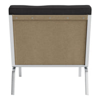Black and tan modern chair with a textured fabric back and sleek metal legs. Ideal for contemporary decor.
