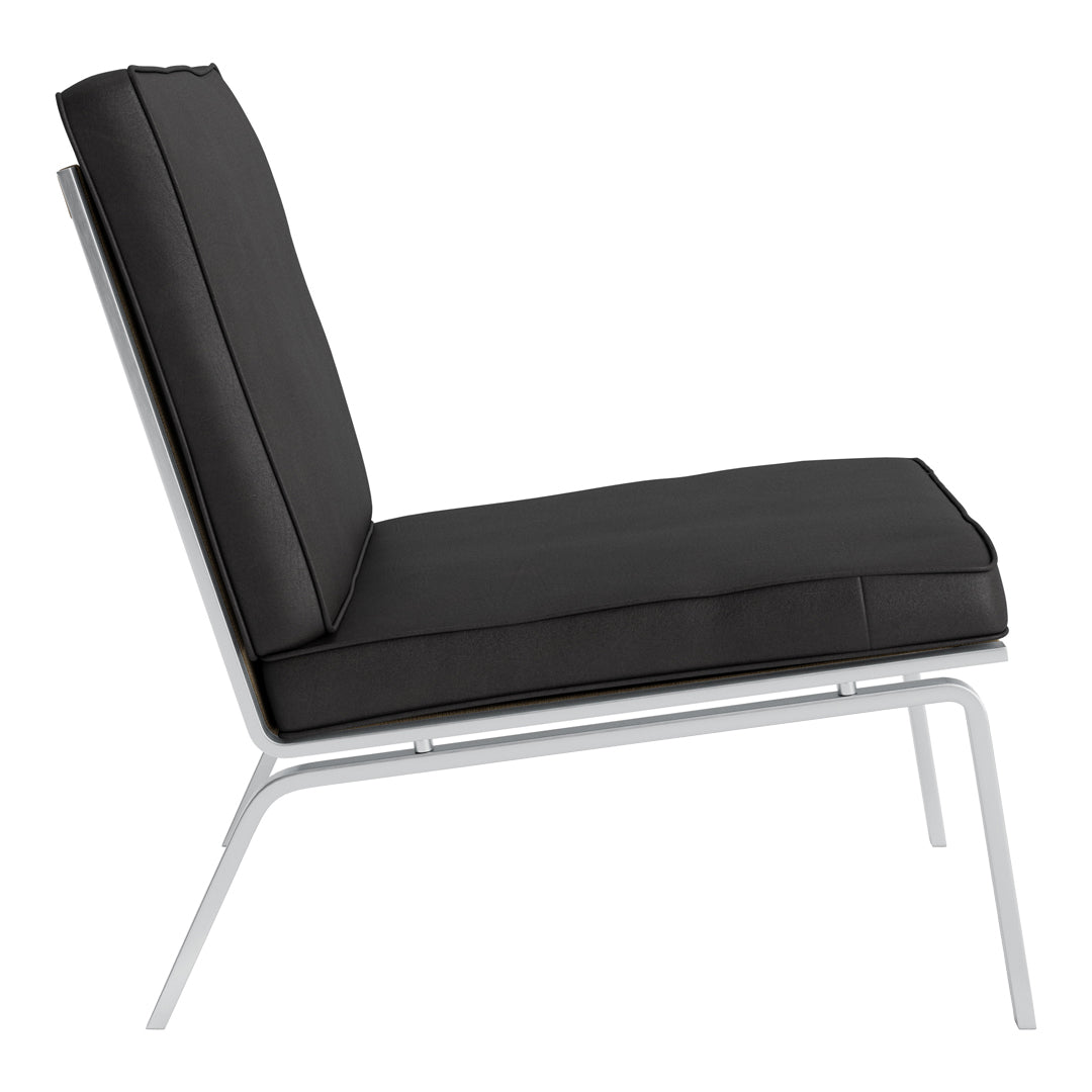 Black padded lounge chair against a sleek white frame, featuring a minimalist design with clean lines.