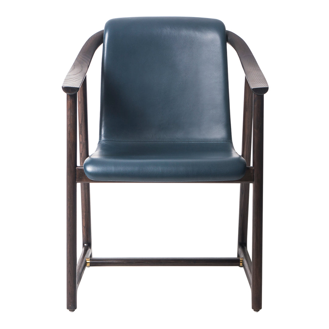 Modern armchair featuring a dark teal seat and rich walnut wood frame, showcasing a sleek, minimalist design.
