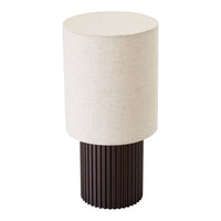 Beige cylindrical lampshade on a ribbed dark brown base, creating a modern and elegant contrast.