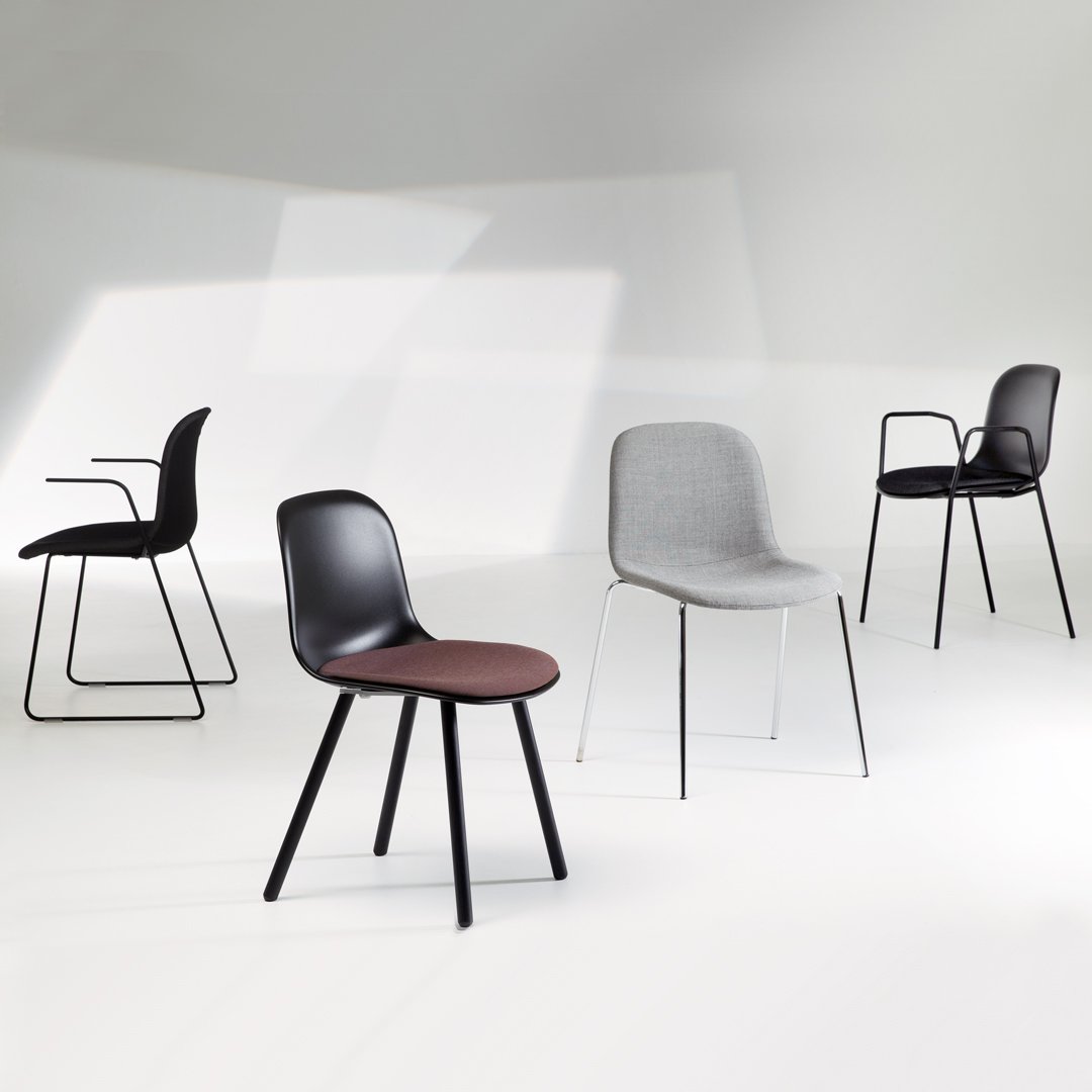 "Collection of modern chairs in black, gray, and brown, featuring various textures and sleek designs."
