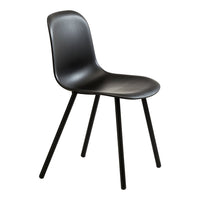 Black modern chair with a smooth finish and slender black legs. Perfect for minimalist décor.