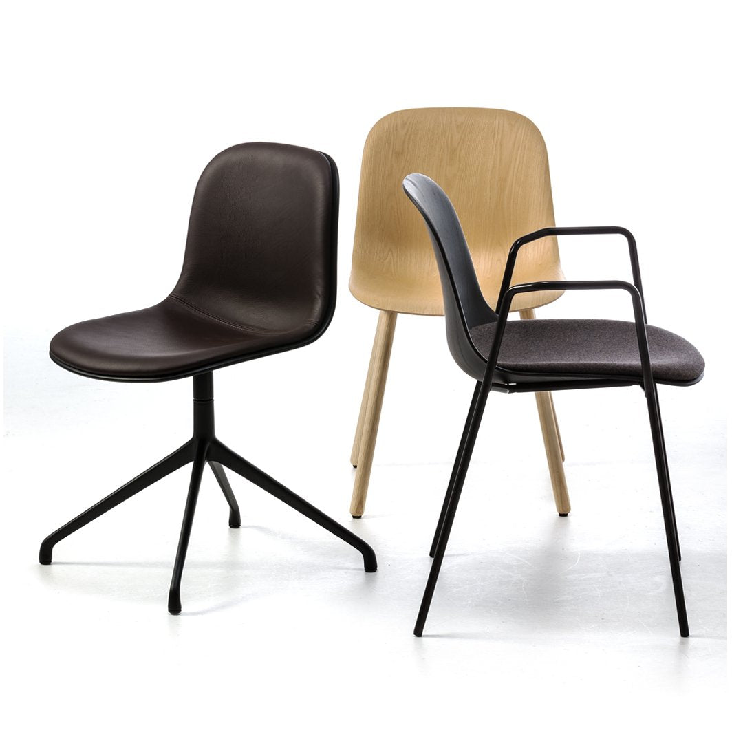 Three modern chairs in dark brown, light wood, and black metal finishes, showcasing sleek and minimalist designs.
