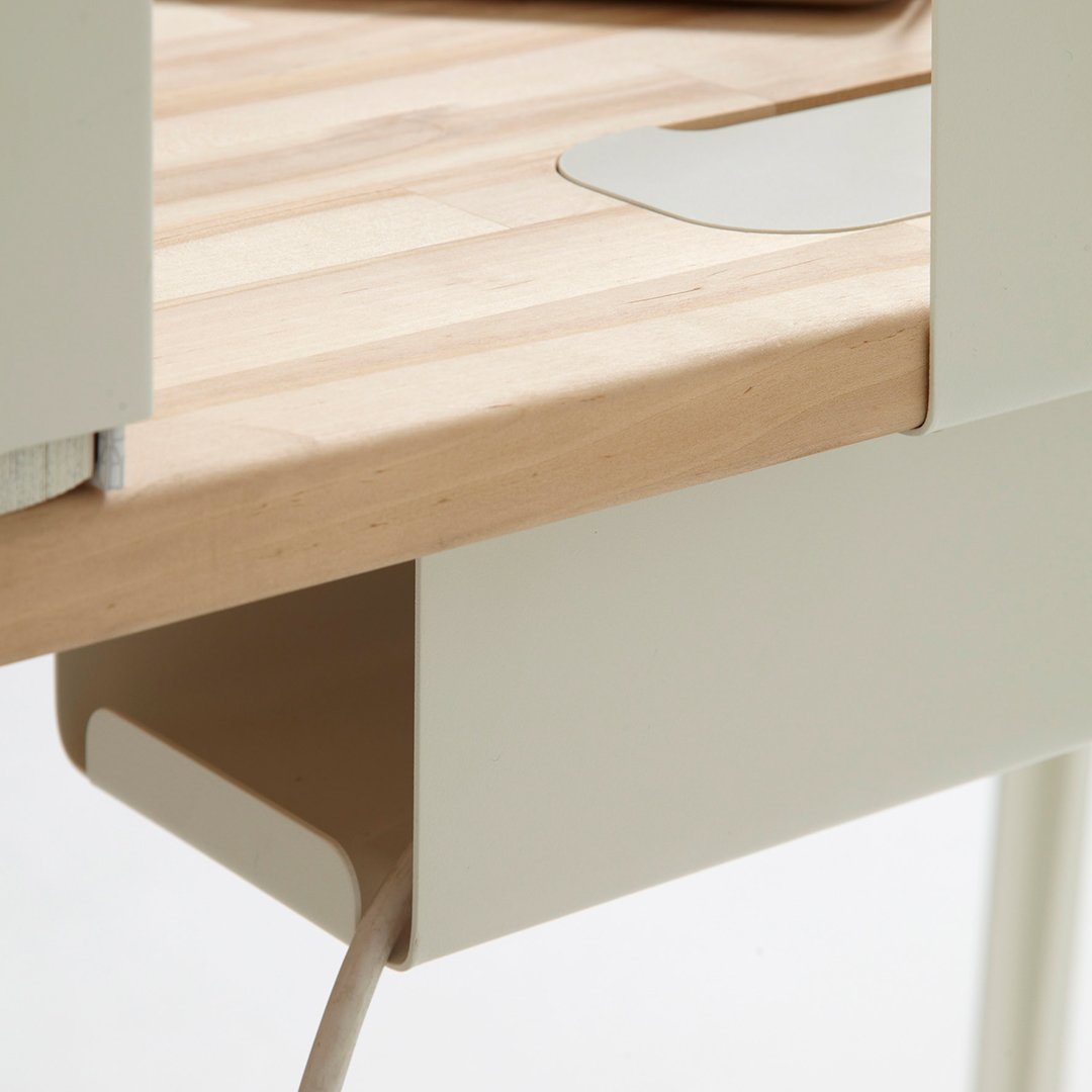 Light wood surface with smooth, cream-colored accents and minimalist design. Clean lines and modern aesthetic.