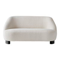 Soft white textured sofa with smooth, rounded edges and black wooden legs, featuring a minimalist design.
