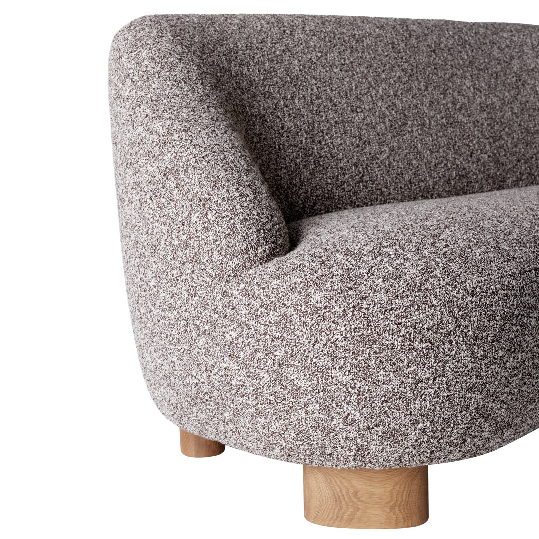 Beige and gray textured fabric sofa with rounded edges and wooden legs. Perfect for modern living spaces.