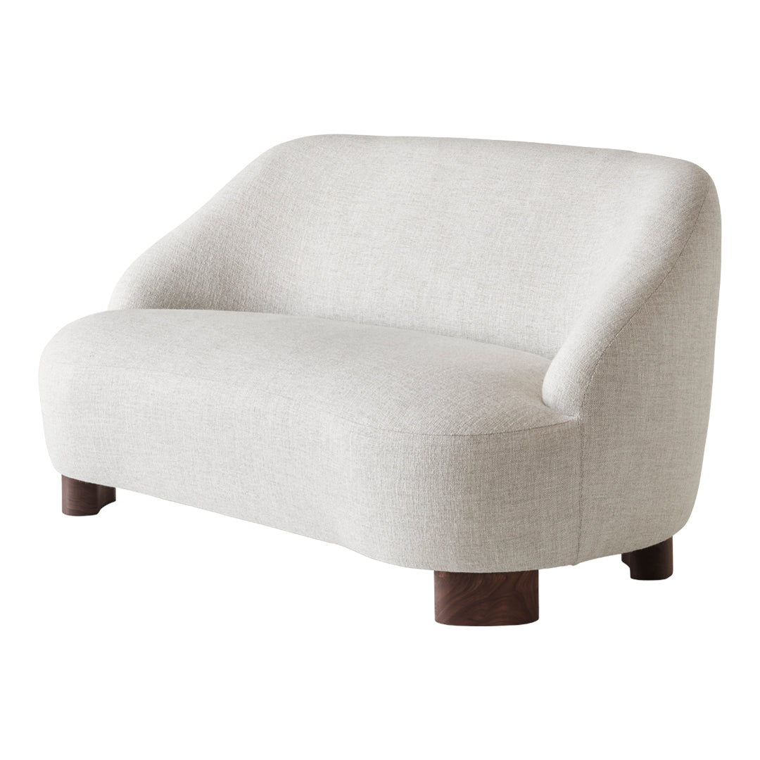 "Light beige modern sofa with soft curves and dark wooden legs, featuring a minimalist, textured fabric."