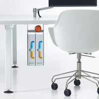 White desk with gray accents, featuring a sleek silver organizer with colorful blue and orange design, alongside a red apple.
