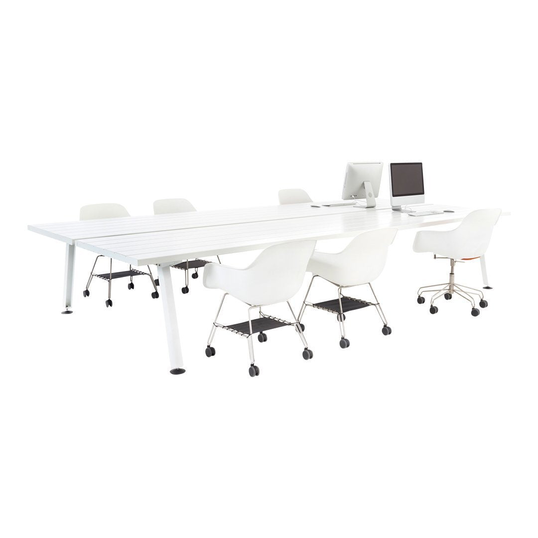 White contemporary office table with matching chairs, featuring sleek lines and a minimalist design.