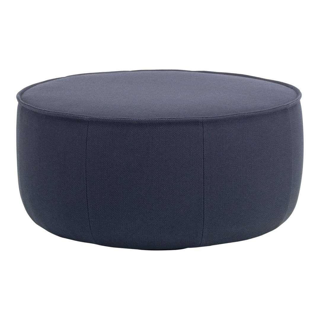 Navy blue round pouf with a smooth fabric texture and minimalistic design, perfect for versatile home decor.