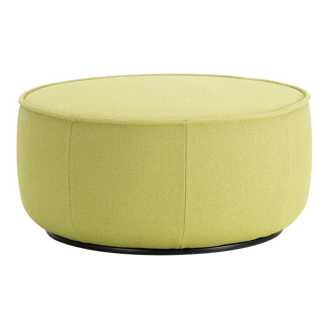Round ottoman in vibrant lime green fabric with a smooth texture and minimalist design. Perfect for modern decor.