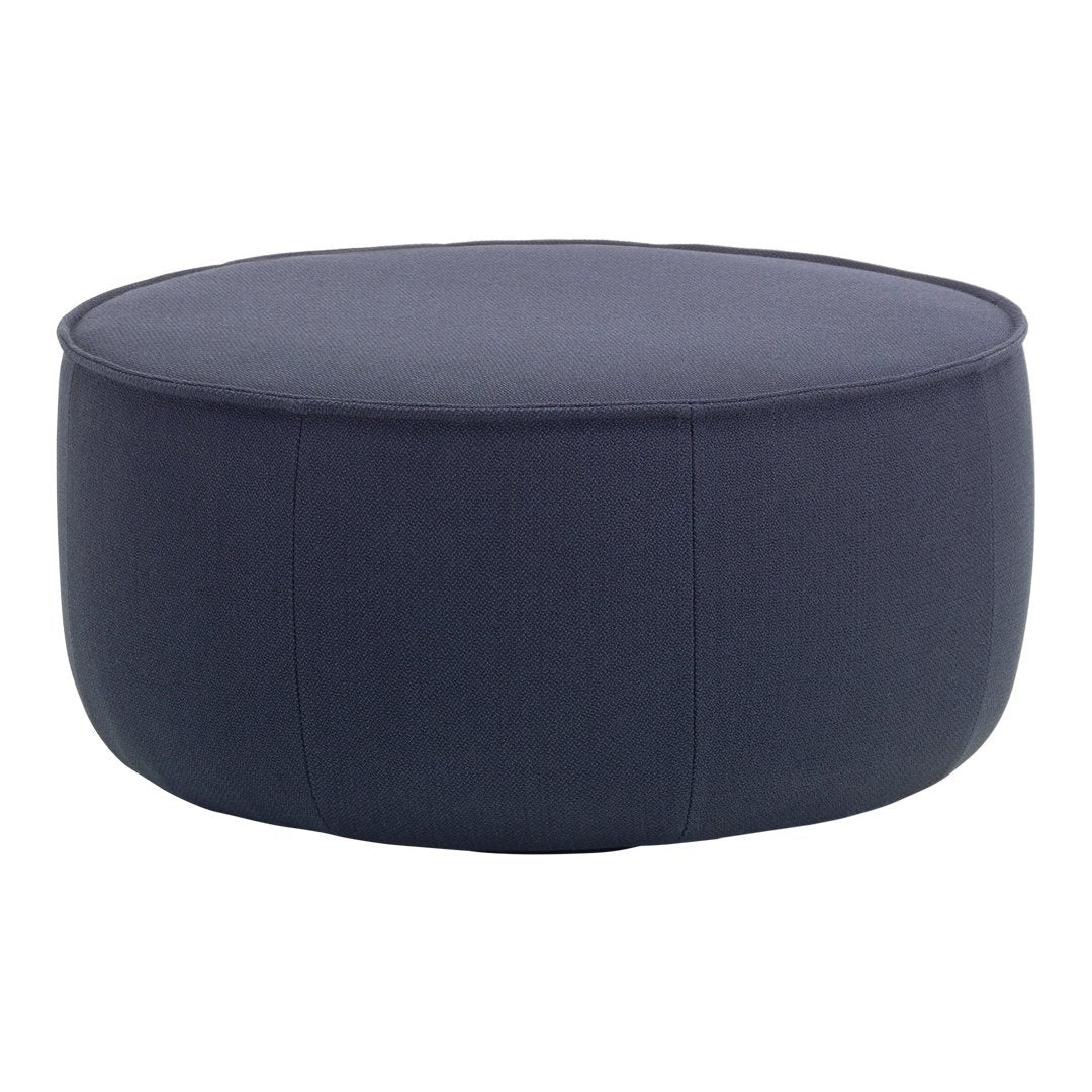 Round navy blue ottoman with a smooth, solid fabric texture and minimal stitching detail. Ideal for modern decor.