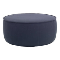Round navy blue ottoman with a smooth, solid fabric texture and minimal stitching detail. Ideal for modern decor.