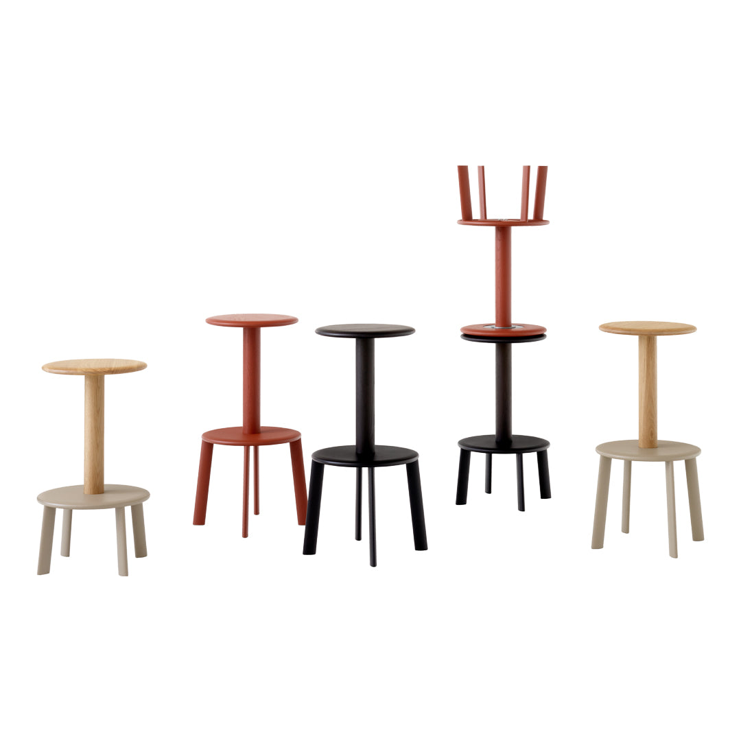 Set of five modern stools in cream, terracotta, black, and natural wood finishes with sleek, minimalist designs.