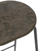 Dark gray, textured round stool seat with black metal legs, featuring subtle variations in color and pattern.