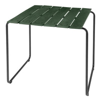 Green slat top table with a sleek black metal frame, perfect for outdoor or indoor use.