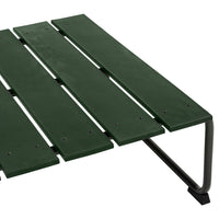 Green slatted surface with a sleek black metal frame, perfect for outdoor settings.