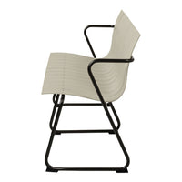 Light beige textured chair with a sleek black metal frame, featuring a minimalist design and curved lines.