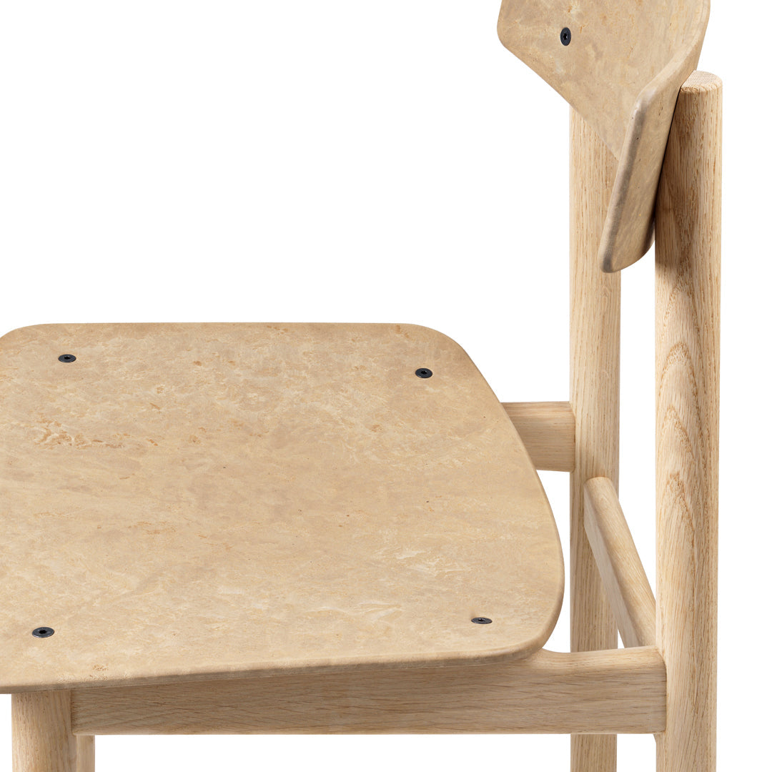 Light natural wood chair with a smooth, minimalist design and subtle grain pattern. Perfect for modern decor.