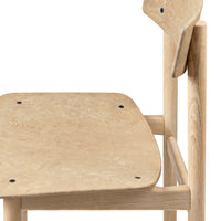 Light natural wood chair with a smooth, minimalist design and subtle grain pattern. Perfect for modern decor.