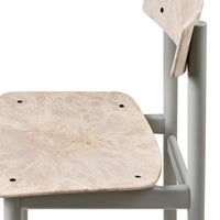 Light beige patterned seat with smooth gray legs, showcasing a minimalist design. Perfect for modern interiors.