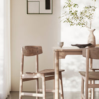 Light wood dining table set with natural tones, featuring a minimalist design and soft shadows. Perfect for modern decor.