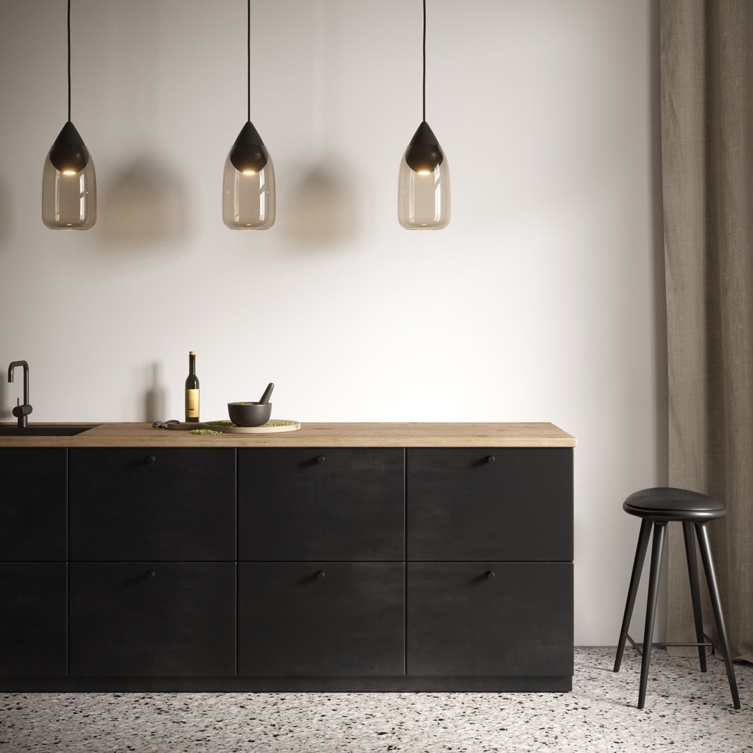 Modern black kitchen cabinet with wood countertop, featuring dark glass pendant lights and a textured floor pattern.