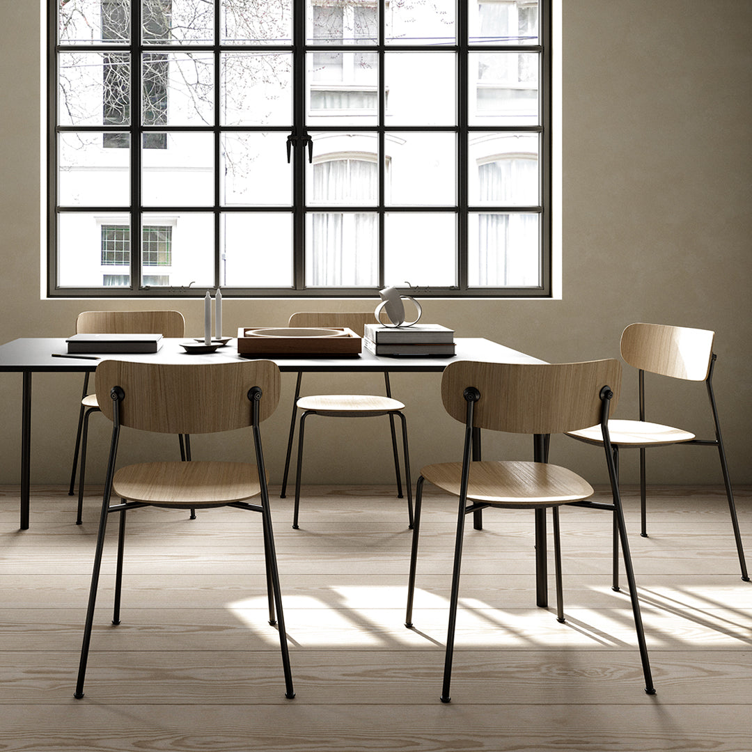 Modern wooden dining chairs with natural wood finishes and sleek black metal legs, featuring minimalistic design.