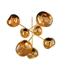 Gold metallic pendant light with organic, rounded shapes reflecting warm amber tones. Ideal for modern decor.