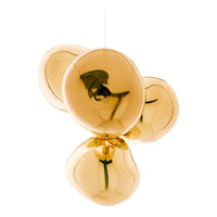 Gold pendant light with smooth, rounded shapes and a glossy finish, reflecting light beautifully. Ideal for modern decor.