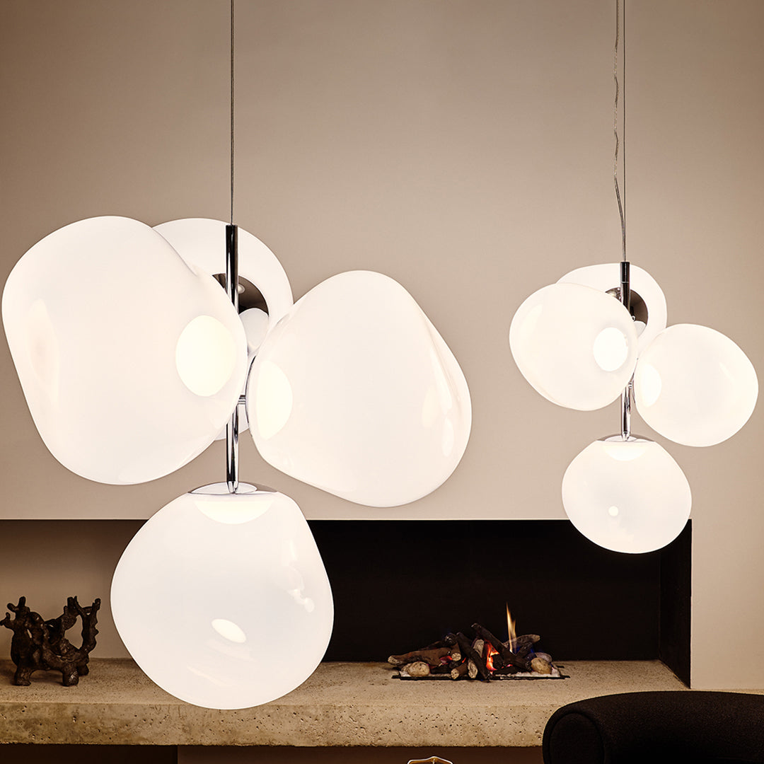 White organic-shaped pendant lights with glossy finish, featuring a modern, minimalist design and playful arrangement.