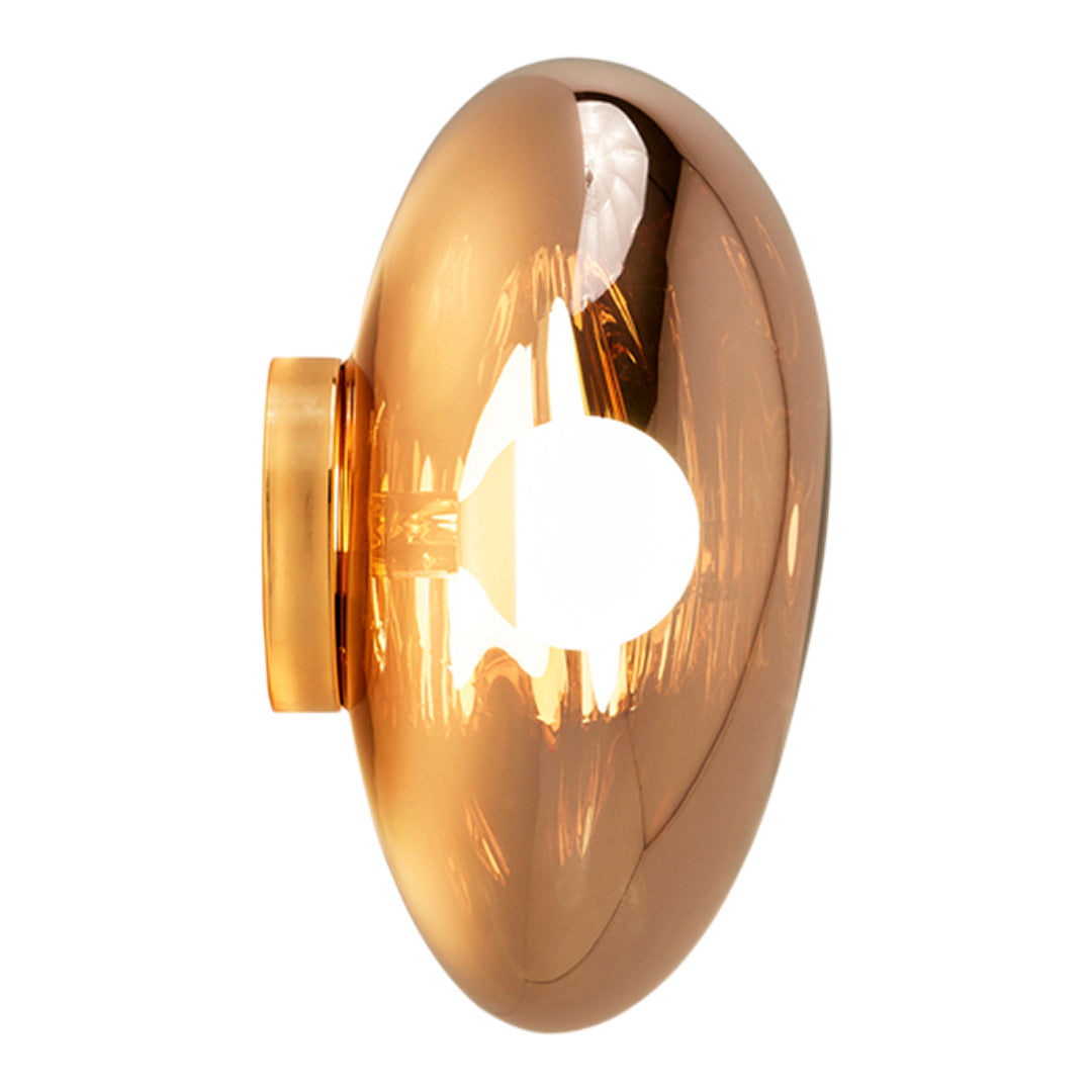 Glossy metallic gold wall lamp with smooth oval shape and minimalist design, reflecting light beautifully.