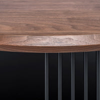 Walnut wood top with rich brown tones, featuring smooth, natural grain. Black metal legs create a modern contrast.