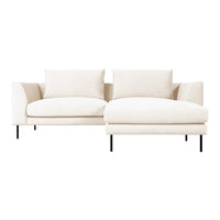 Soft beige sofa with minimalist design, featuring clean lines and plush cushions, ideal for modern decor.