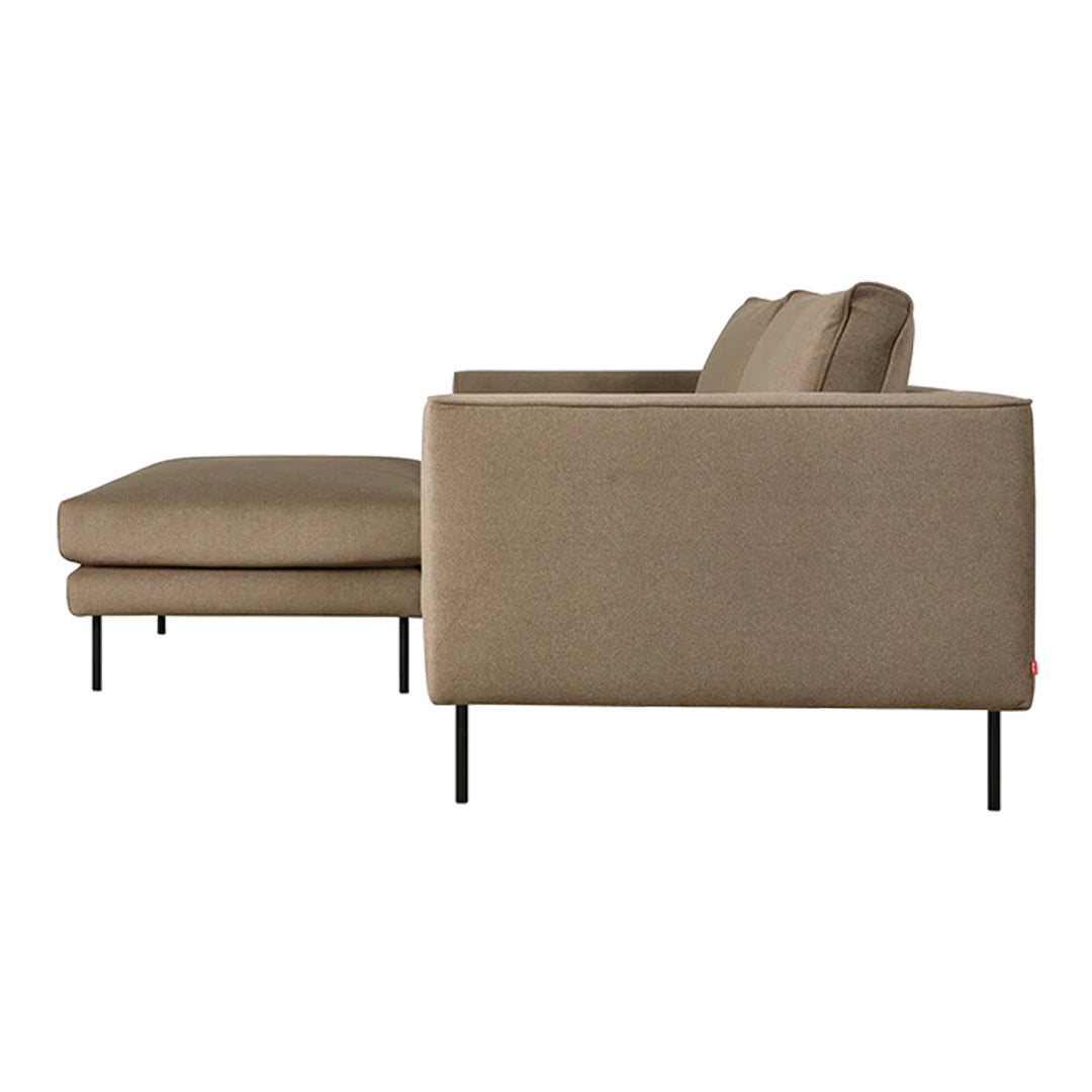 Beige upholstery with a smooth texture and minimalist design, accented by sleek black metal legs.