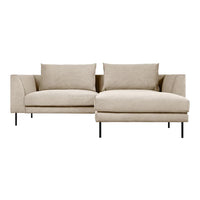 Beige sectional sofa with clean lines and a minimalist design, featuring soft, textured upholstery and black metal legs.
