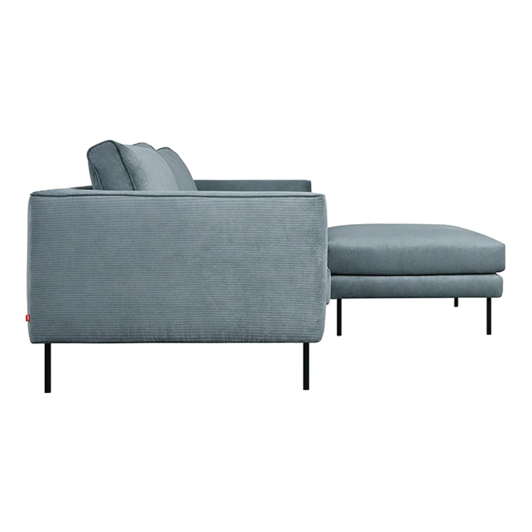 Contemporary gray sectional sofa with clean lines and plush cushions, featuring a sleek black metal base.