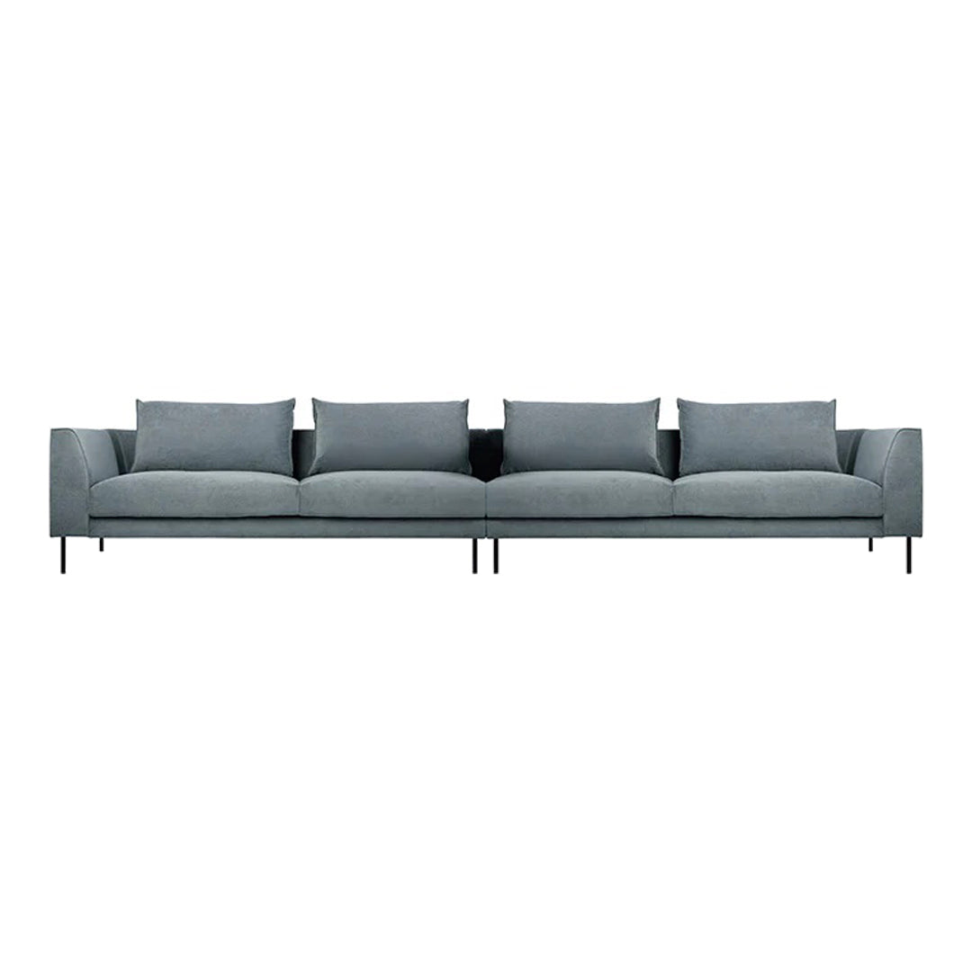 Modern light gray sofa with clean lines and soft cushions, perfect for contemporary living spaces.