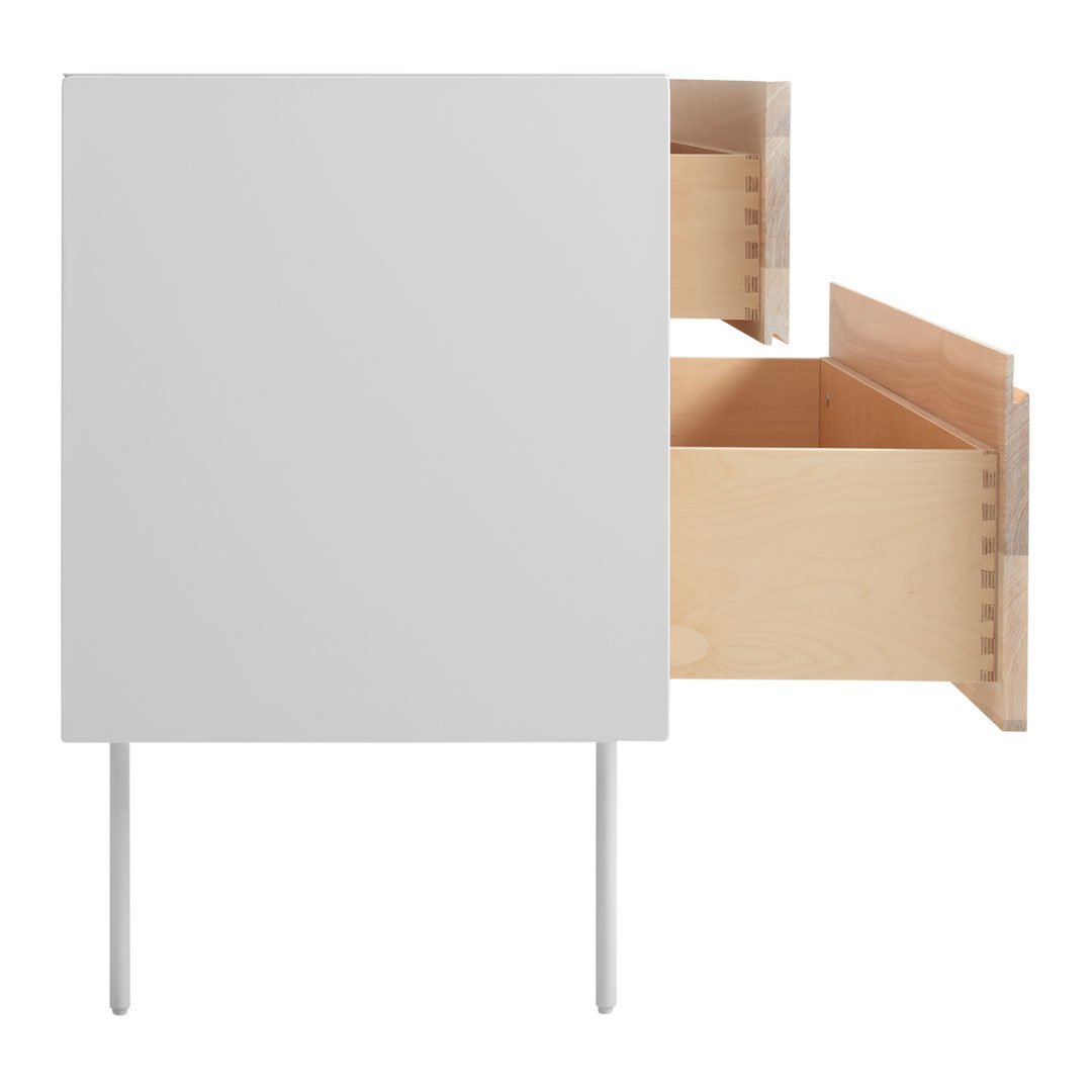 Modern white cabinet with natural wood drawers and sleek metal legs, showcasing a clean, minimalist design.