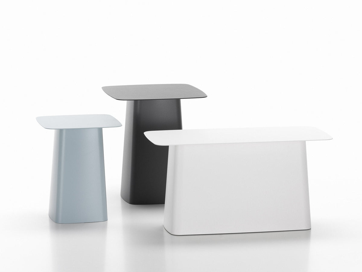 Set of three modern side tables in light blue, black, and white, featuring sleek, minimalist designs and smooth finishes.