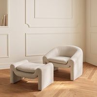 Beige textured lounge chair and ottoman set with a minimalist design, complementing a light-colored room.