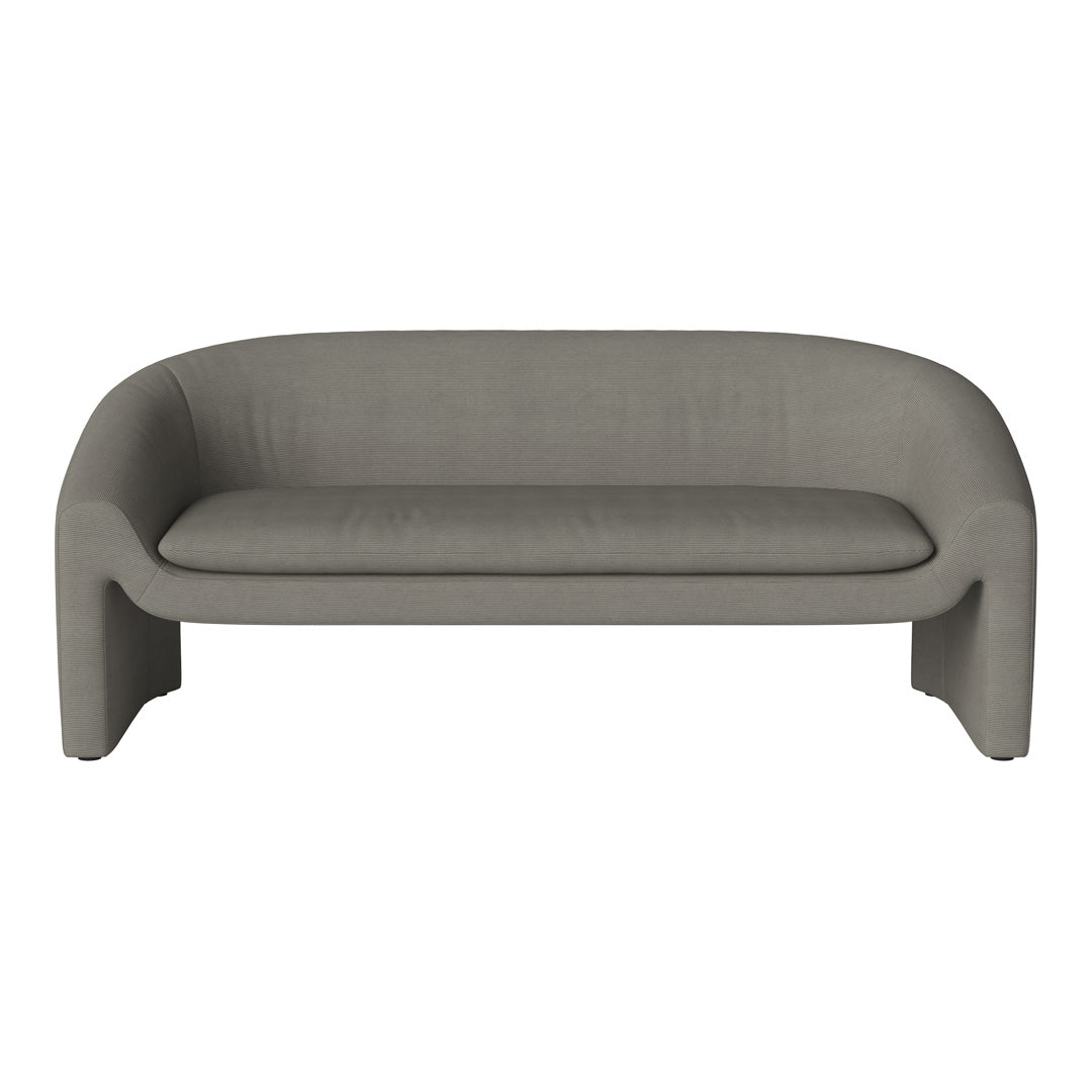 Sleek, curved sofa in soft gray fabric with a muted texture, adding a modern touch to any living space.